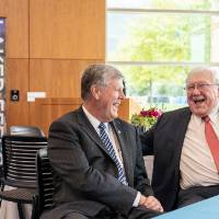President Thomas J. Haas laughing with President Emeritus Arend Lubbers at the Arend and Nancy Lubbers Student Services Center Dedication